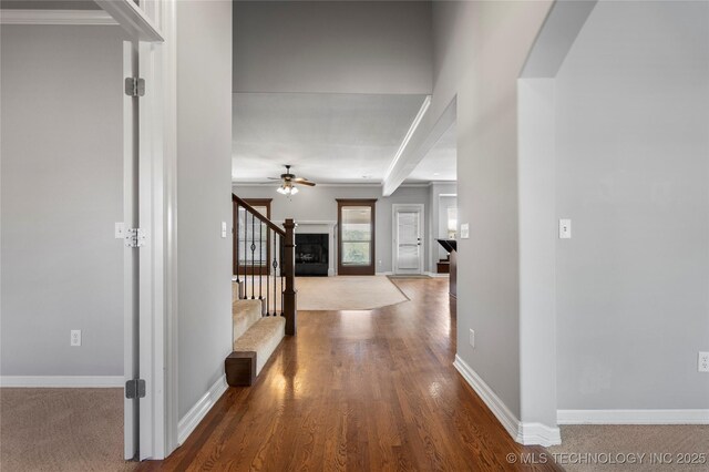 9502 S 73rd E Ave, Tulsa, OK 74133 - corridor with stairway, baseboards, beam ceiling, and wood finished floors