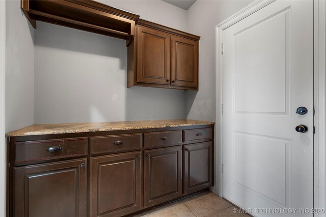 9502 S 73rd E Ave, Tulsa, OK 74133 - laundry room featuring light tile patterned floors