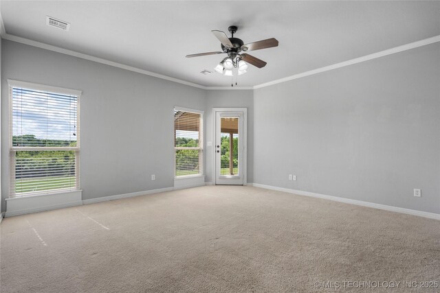 9502 S 73rd E Ave, Tulsa, OK 74133 - spare room with baseboards, light colored carpet, plenty of natural light, and ornamental molding