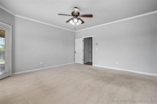 9502 S 73rd E Ave, Tulsa, OK 74133 - spare room with crown molding, ceiling fan, carpet floors, and baseboards