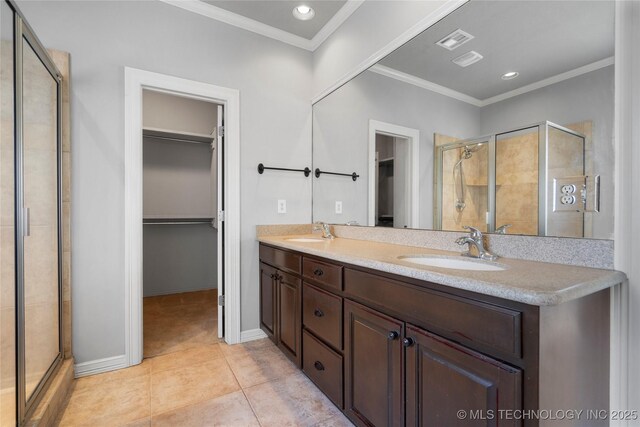 9502 S 73rd E Ave, Tulsa, OK 74133 - bathroom with a sink, a walk in closet, and a shower stall