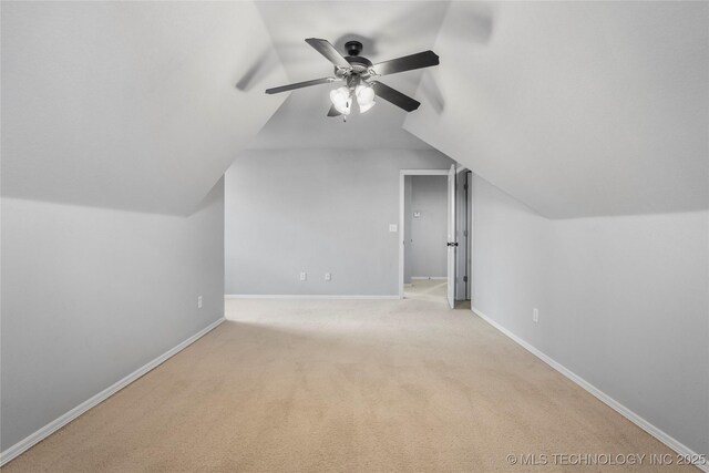 9502 S 73rd E Ave, Tulsa, OK 74133 - bonus room with baseboards, ceiling fan, vaulted ceiling, and light carpet