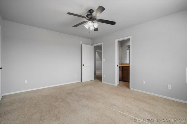 9502 S 73rd E Ave, Tulsa, OK 74133 - unfurnished bedroom featuring light colored carpet, baseboards, ceiling fan, and ensuite bath
