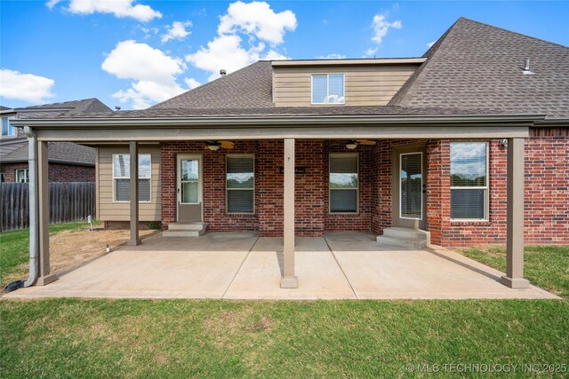 9502 S 73rd E Ave, Tulsa, OK 74133 - back of house featuring brick siding, a ceiling fan, fence, and entry steps