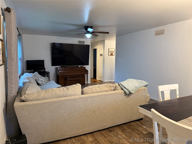 116 S Camden St, Muskogee, OK 74403 - living room featuring a ceiling fan, dark wood-style flooring, and baseboards