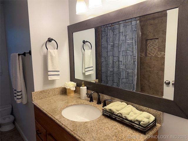 full bath featuring vanity, toilet, and curtained shower