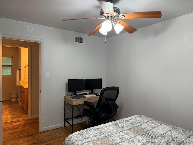 116 S Camden St, Muskogee, OK 74403 - bedroom featuring wood finished floors, baseboards, an office area, and ceiling fan