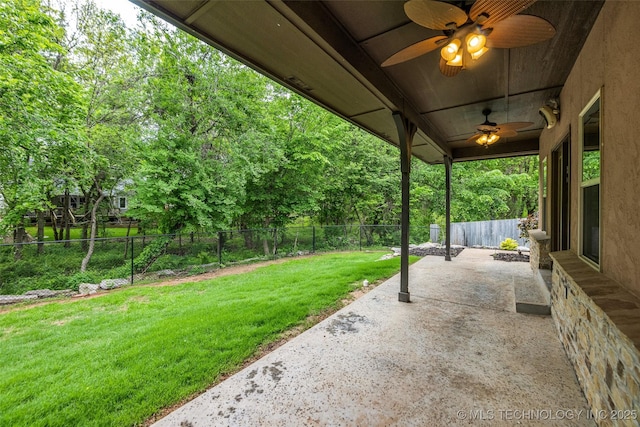 view of patio featuring a fenced backyard and ceiling fan