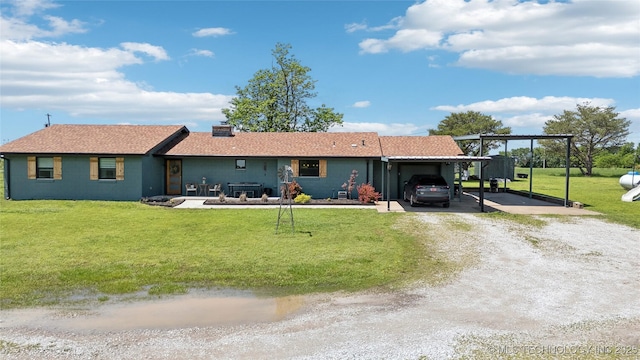 7207 E 166th St, Collinsville, OK 74021 - ranch-style home with dirt driveway, a front lawn, and an attached carport