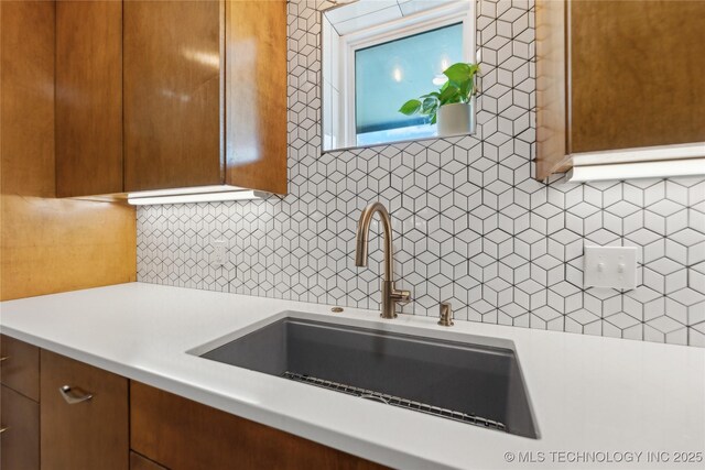 7207 E 166th St, Collinsville, OK 74021 - kitchen featuring light countertops, backsplash, and a sink
