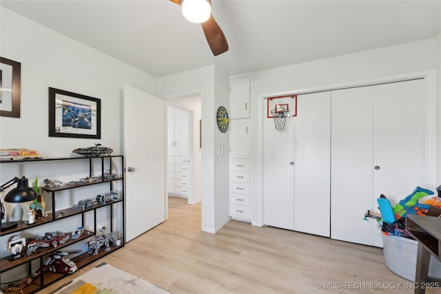 7207 E 166th St, Collinsville, OK 74021 - bedroom featuring light wood finished floors, a closet, and ceiling fan