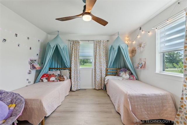 7207 E 166th St, Collinsville, OK 74021 - bedroom with light wood-style floors and a ceiling fan
