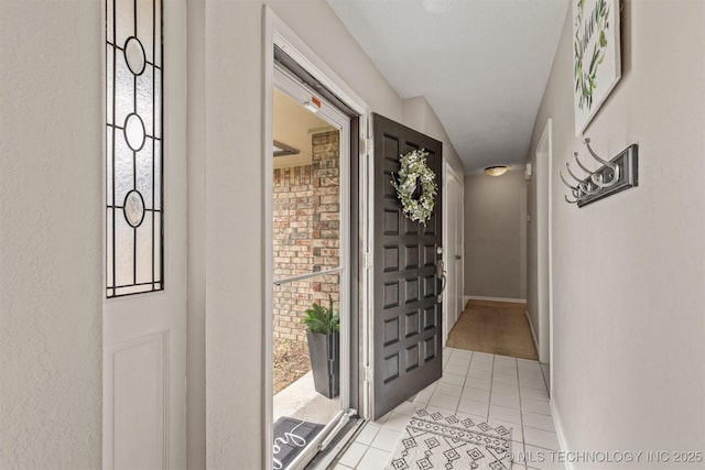 interior space featuring light tile patterned floors and plenty of natural light
