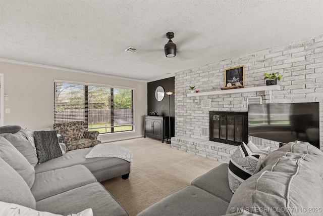 living room with visible vents, carpet flooring, a fireplace, a textured ceiling, and a ceiling fan
