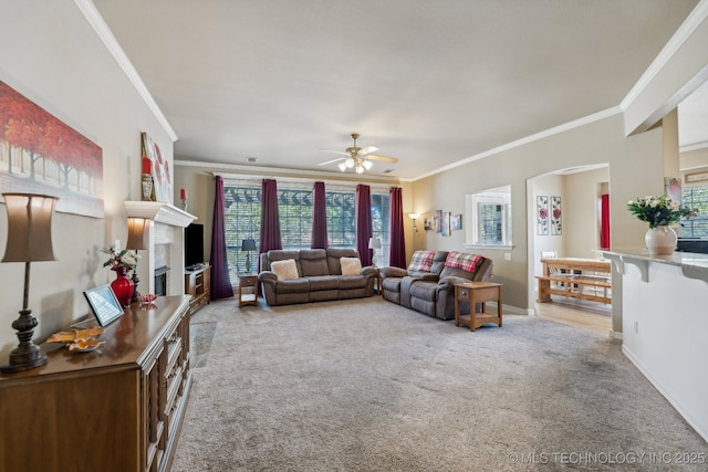 7408 E Forest Ridge Blvd, Broken Arrow, OK 74014 - living room with carpet floors, ornamental molding, a fireplace, and ceiling fan