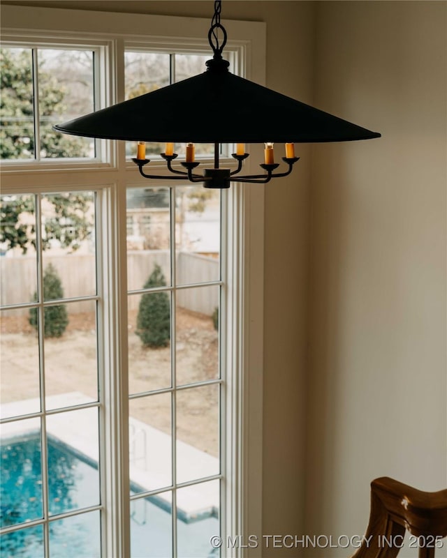 interior details featuring a notable chandelier