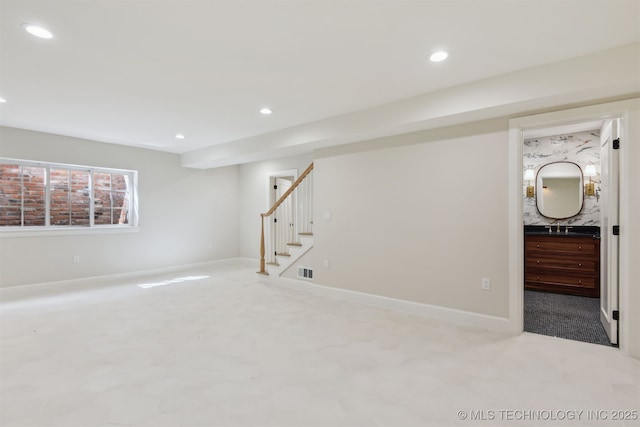 basement featuring recessed lighting, carpet floors, stairs, and visible vents