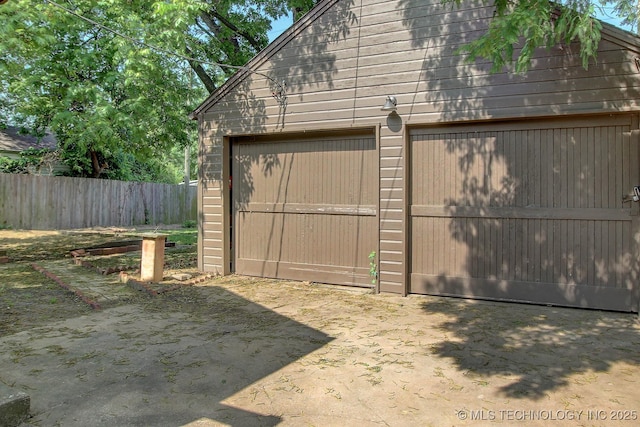 garage with fence