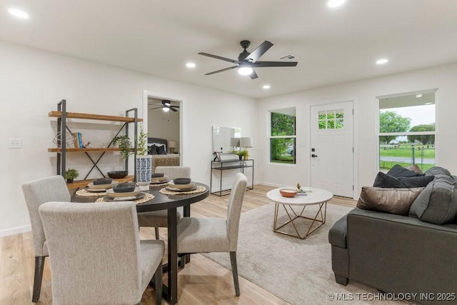 dining room with light wood-type flooring, a ceiling fan, and recessed lighting