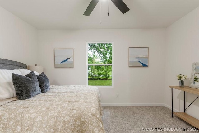 bedroom featuring carpet floors, a ceiling fan, and baseboards