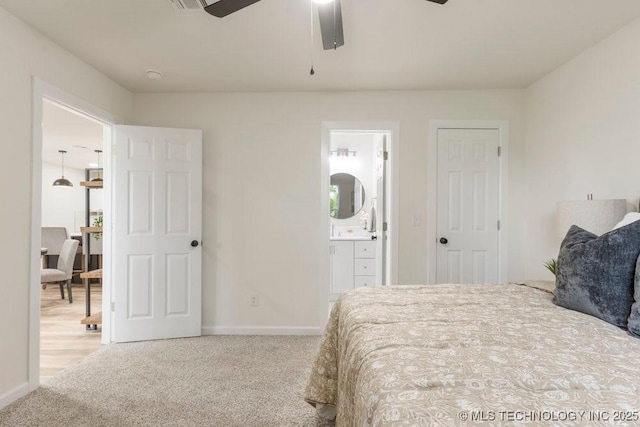bedroom with connected bathroom, baseboards, ceiling fan, and carpet