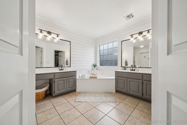 309 E 125th Ct S, Jenks, OK 74037 - bathroom featuring visible vents, two vanities, a sink, and tile patterned flooring