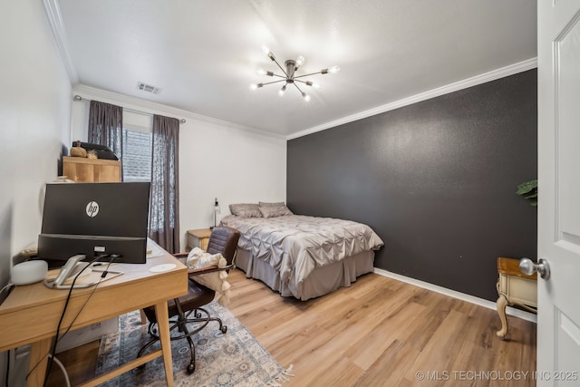 bedroom featuring crown molding, visible vents, light wood-style flooring, and an inviting chandelier