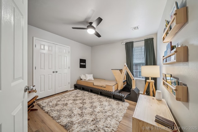309 E 125th Ct S, Jenks, OK 74037 - bedroom featuring ceiling fan, visible vents, light wood finished floors, and a closet