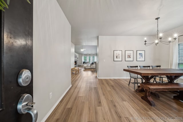 309 E 125th Ct S, Jenks, OK 74037 - dining space with baseboards, a notable chandelier, and light wood-type flooring