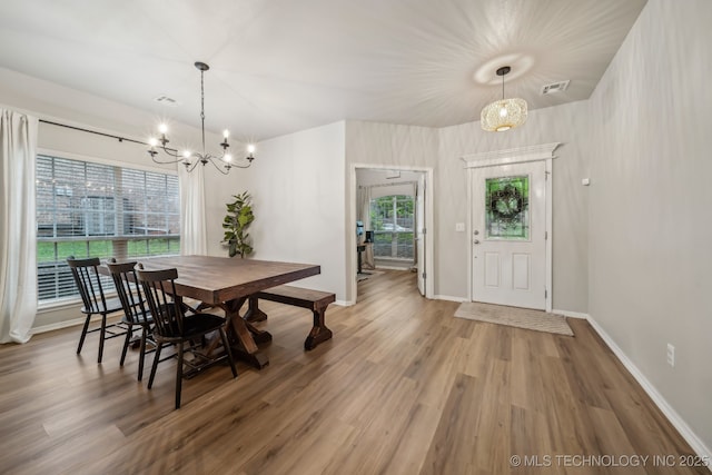 309 E 125th Ct S, Jenks, OK 74037 - dining room with a notable chandelier, a wealth of natural light, visible vents, and wood finished floors