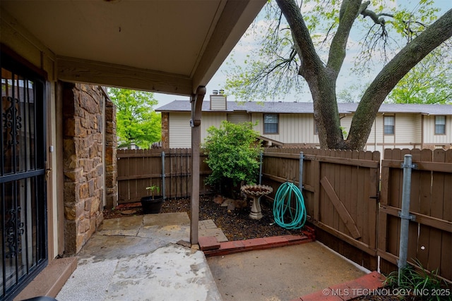 6371 S 80th Ave E Unit G, Tulsa, OK 74133 - view of patio / terrace featuring a gate