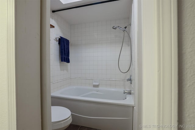 full bathroom featuring shower / bath combination, tile patterned floors, and toilet