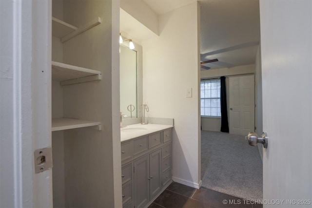 bathroom with a ceiling fan, tile patterned floors, and vanity