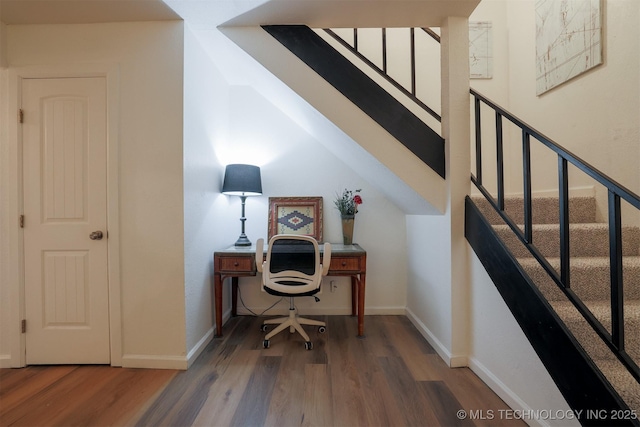 office area with baseboards and wood finished floors