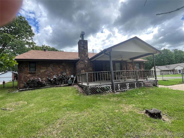 3316 Maple Dr, Sand Springs, OK 74063 - rear view of property with a chimney, stone siding, and a ceiling fan