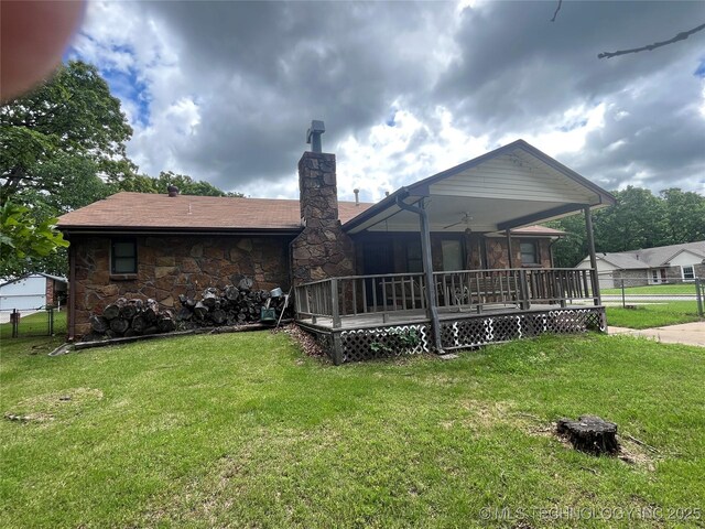 3316 Maple Dr, Sand Springs, OK 74063 - rear view of property with a chimney, stone siding, and a ceiling fan