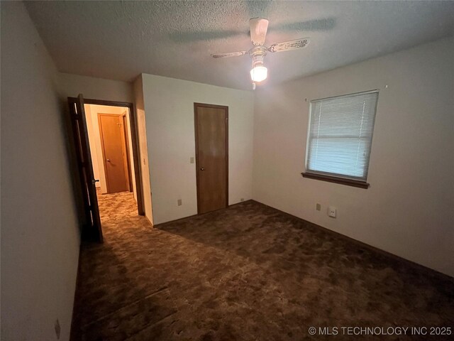 3316 Maple Dr, Sand Springs, OK 74063 - unfurnished bedroom with carpet, a textured ceiling, and ceiling fan