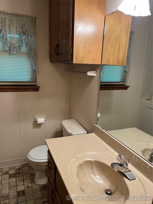 3316 Maple Dr, Sand Springs, OK 74063 - bathroom featuring toilet, vanity, and baseboards
