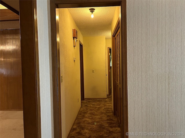 3316 Maple Dr, Sand Springs, OK 74063 - corridor featuring a textured ceiling and carpet