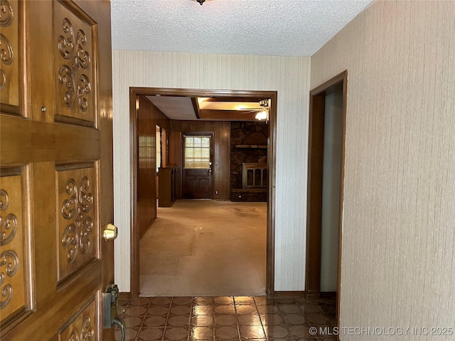 3316 Maple Dr, Sand Springs, OK 74063 - hallway featuring a textured ceiling, carpet flooring, and wallpapered walls