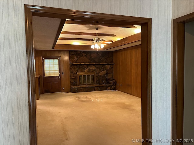 3316 Maple Dr, Sand Springs, OK 74063 - unfurnished living room featuring ceiling fan, a fireplace, carpet, and wooden walls