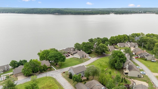 drone / aerial view featuring a water view and a residential view