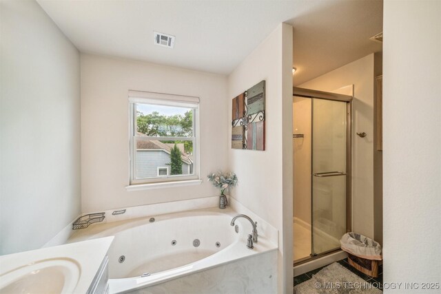 full bath featuring visible vents, a stall shower, a tub with jets, and vanity