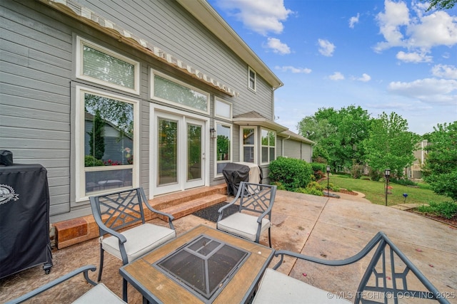 view of patio featuring an outdoor fire pit