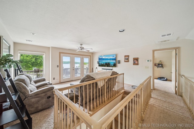 living room with light colored carpet, french doors, a ceiling fan, recessed lighting, and visible vents