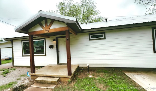 exterior space with metal roof