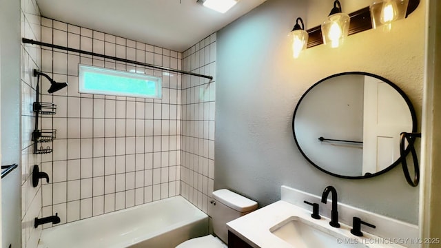 full bathroom featuring vanity, bathtub / shower combination, and toilet