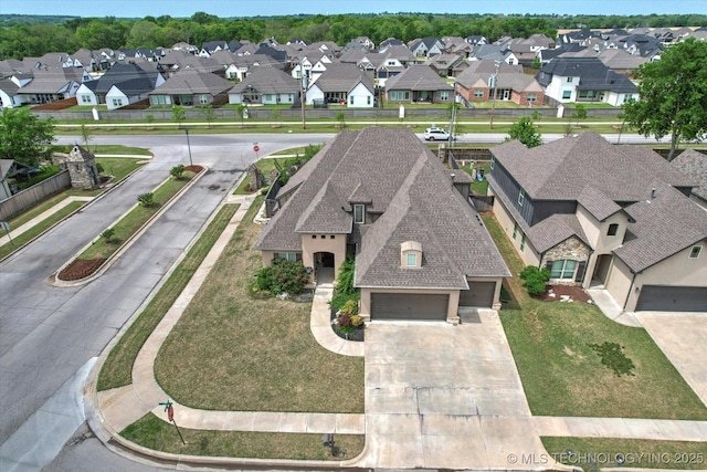birds eye view of property with a residential view