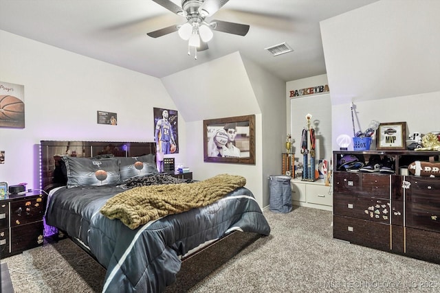 bedroom with carpet flooring, a ceiling fan, visible vents, and vaulted ceiling