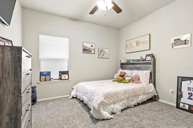 carpeted bedroom featuring baseboards and ceiling fan